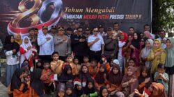 Bupati Zukri Bersama Kapolres Pelalawan AKBP John Louis Letedara, Hadiri Peresmian Jembatan Merah Putih Presisi 